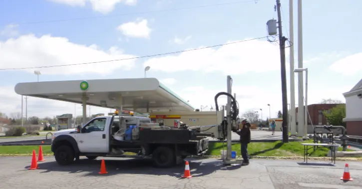 Drilling crew sampling at a gas station during a Phase II assessment
